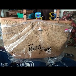 Style Setter thirty one bag with wristlet.